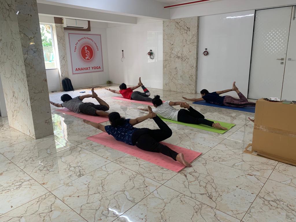 Yoga instructor guiding students in Pune